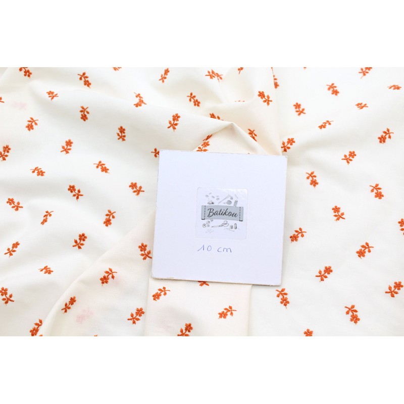 Tissu coton organique broderies fleurs coloris orange