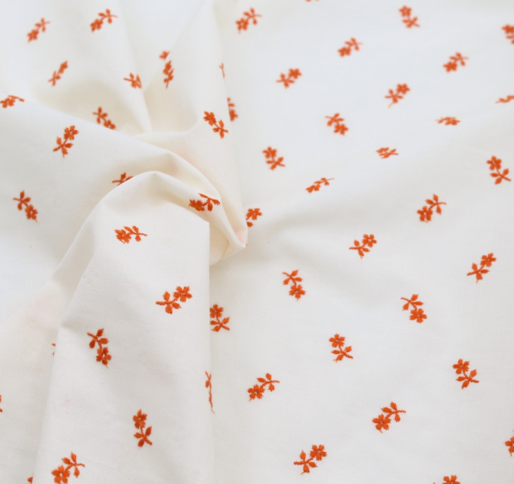 Tissu coton organique broderies fleurs coloris orange
