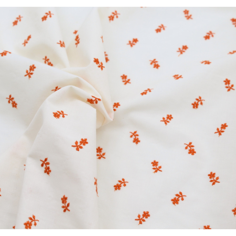 Tissu coton organique broderies fleurs coloris orange