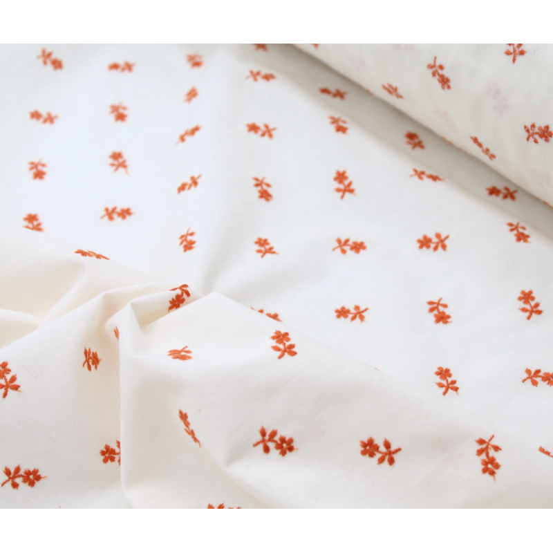 Tissu coton organique broderies fleurs coloris orange