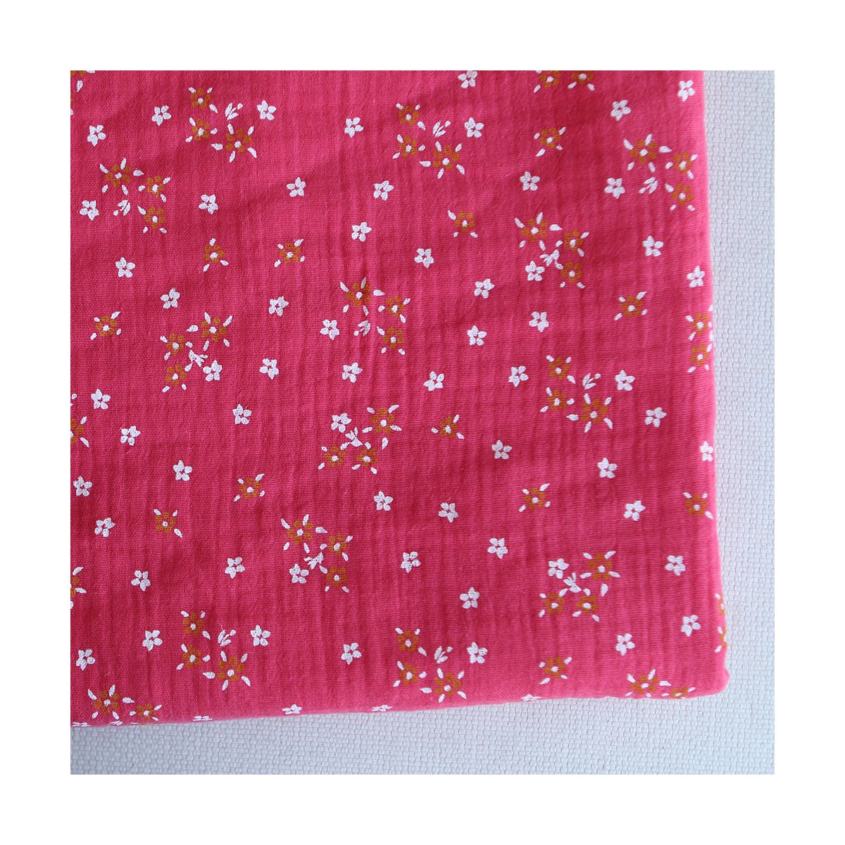 Lena - Double gaze de coton motif fleuri fond framboise