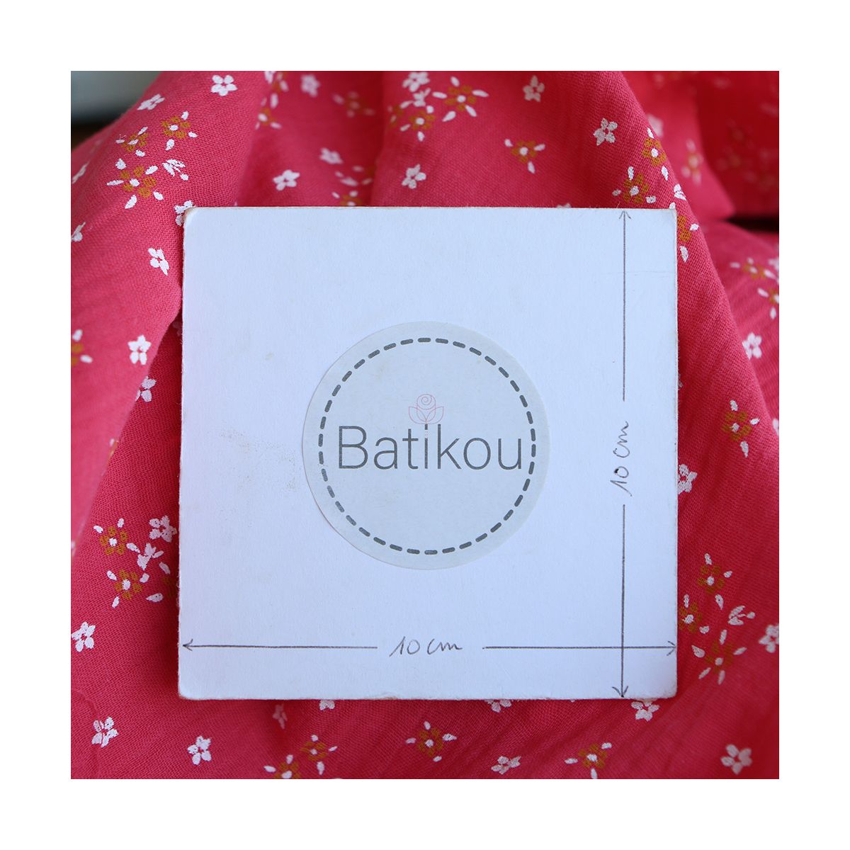 Lena - Double gaze de coton motif fleuri fond framboise