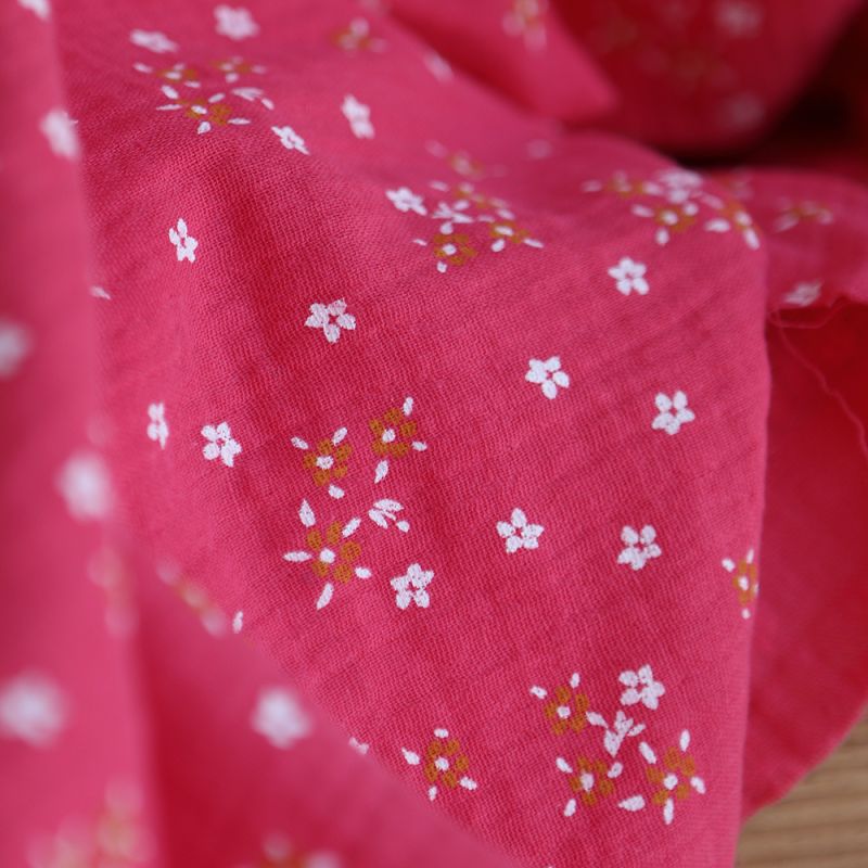 Lena - Double gaze de coton motif fleuri fond framboise