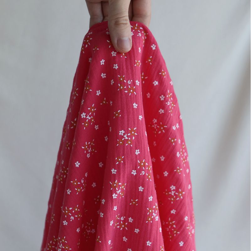 Lena - Double gaze de coton motif fleuri fond framboise