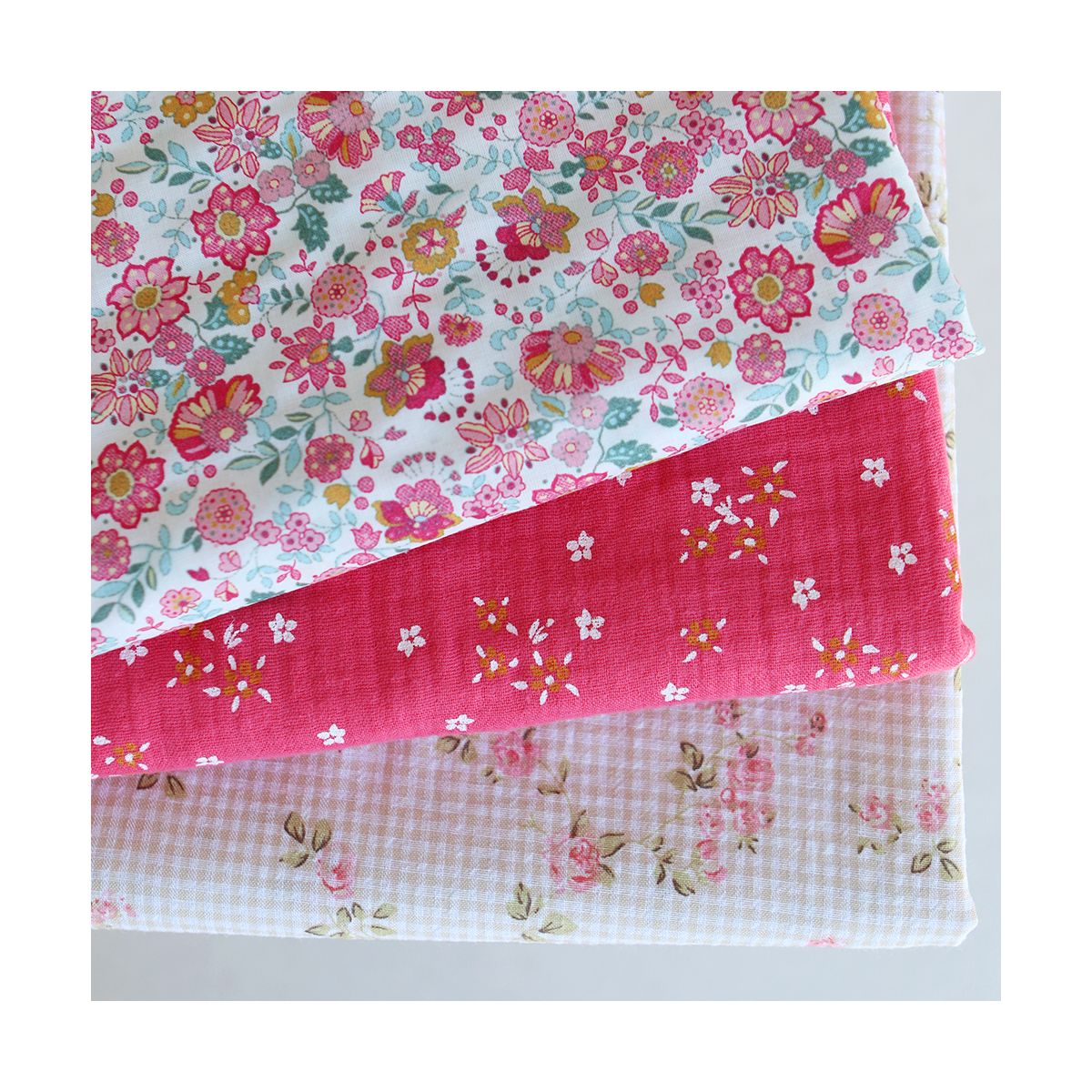 Lena - Double gaze de coton motif fleuri fond framboise