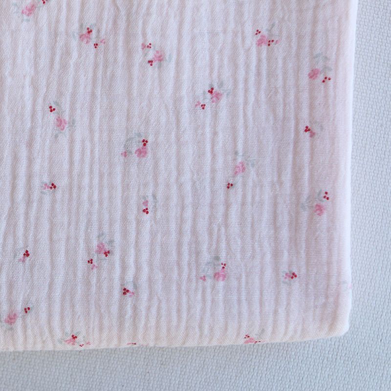 Leonie - Double gaze de coton motif fond rose tendre motif petit fleuri