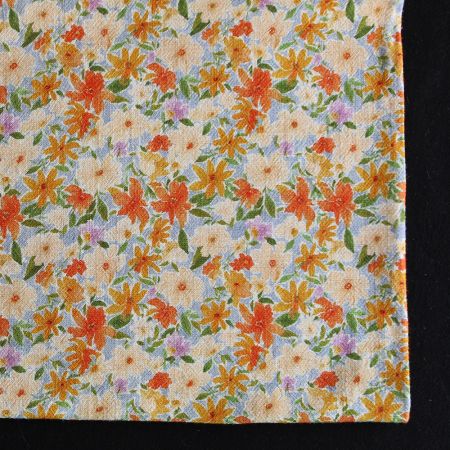 Crêpe lin et viscose imprimé fleuri orangé Crêpe lin et viscose imprimé fleuri orangé