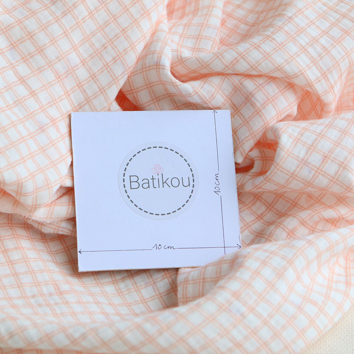 Cherry - Double gaze de coton double face coloris blanc cerises et quadrillage parme et orange Cherry - Double gaze de coton double face coloris blanc cerises et quadrillage parme et orange